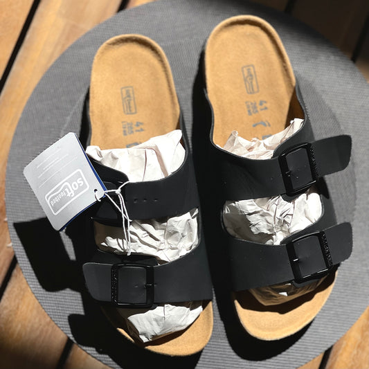 Top view of Birkenstock Arizona Birko-Flor Black showing cork-latex footbed and logo detail