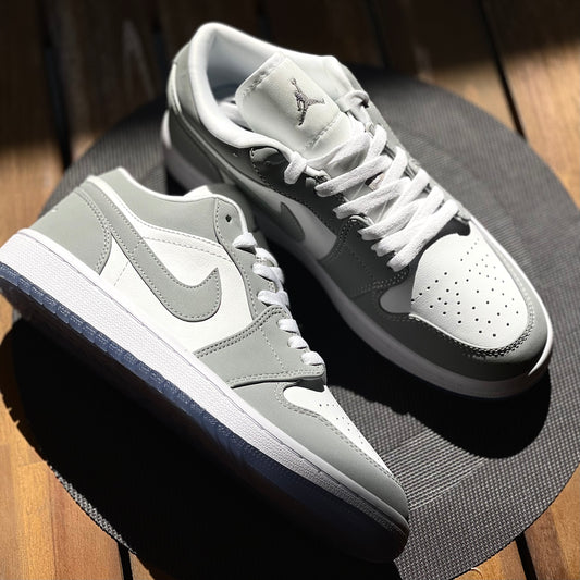 Air Jordan 1 Low Wolf Grey sneaker side profile on clean background