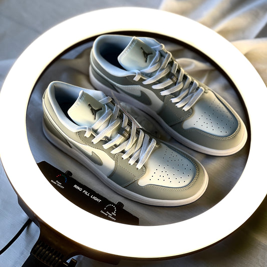 Air Jordan 1 Low Wolf Grey top-down view showing laces, padded tongue, and toe box structure.