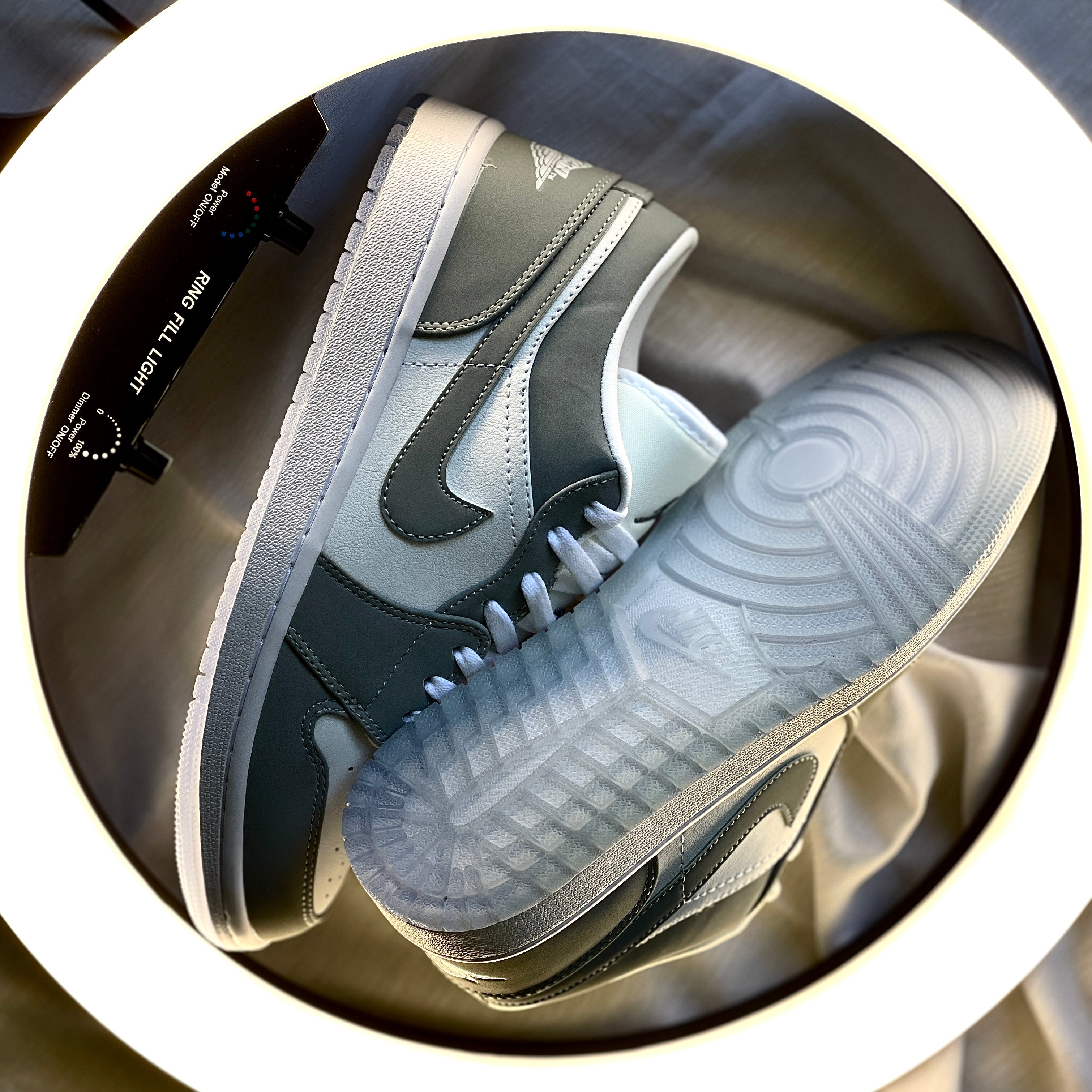 Air Jordan 1 Low Wolf Grey outsole displaying tread pattern and durability details in grey rubber.