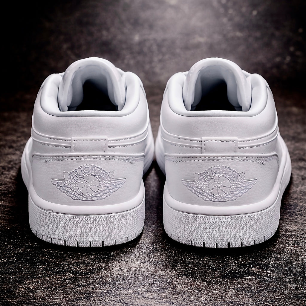 Air Jordan 1 Low Triple white Rear view on polished dark concrete floor
