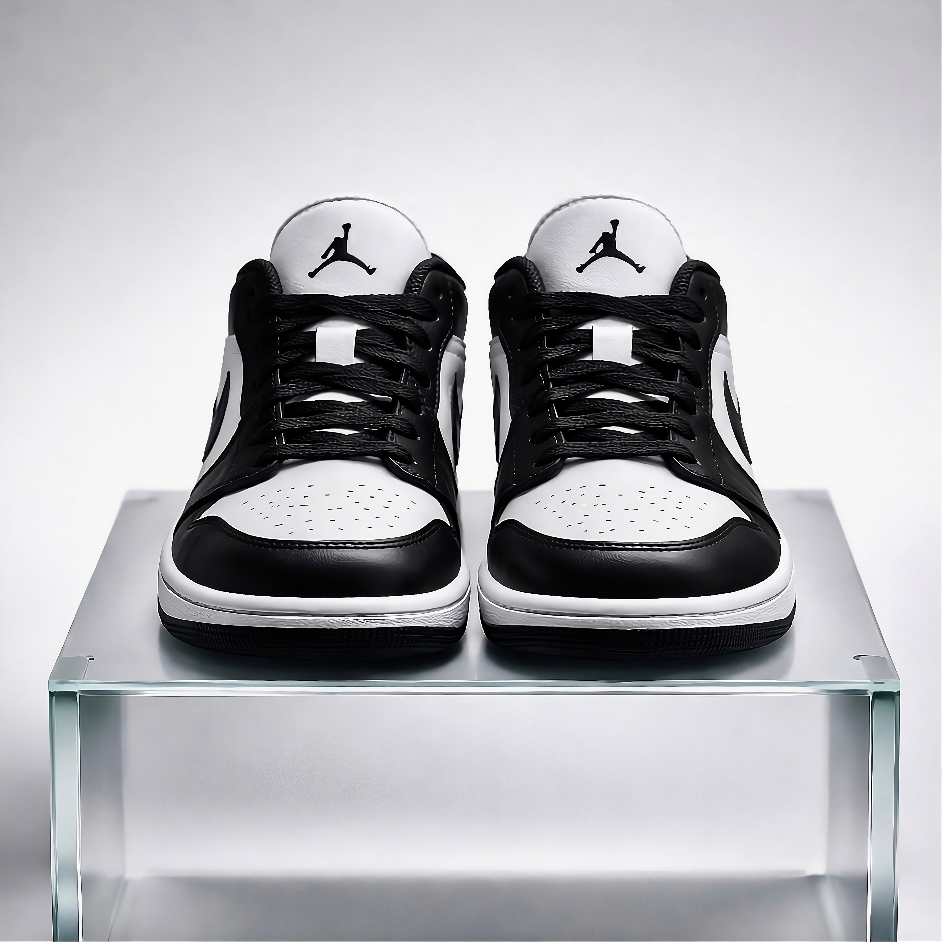 Air Jordan 1 Low front view featuring branding and AJ1 logo 