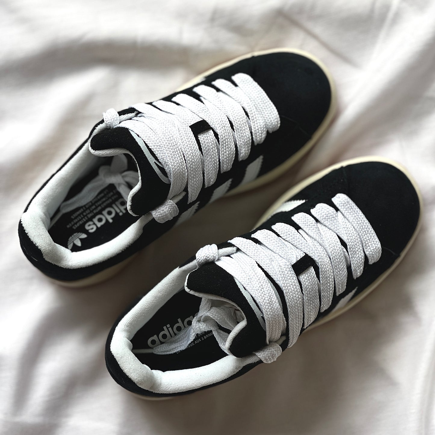 Top view of adidas Campus black suede upper