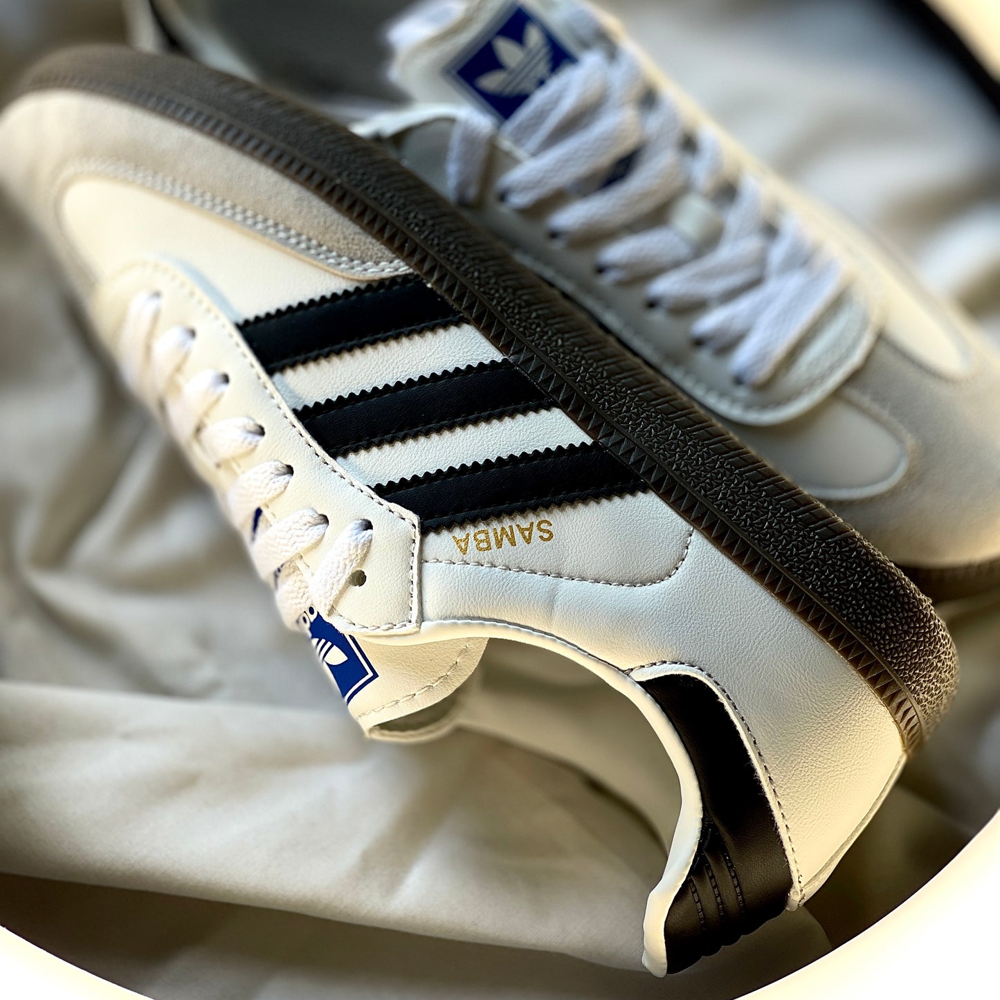 Close-up of Adidas Samba OG White Black Gum leather upper and suede toe overlay
