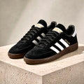 Pair of adidas Handball Spezial Black Gum sneakers angled together