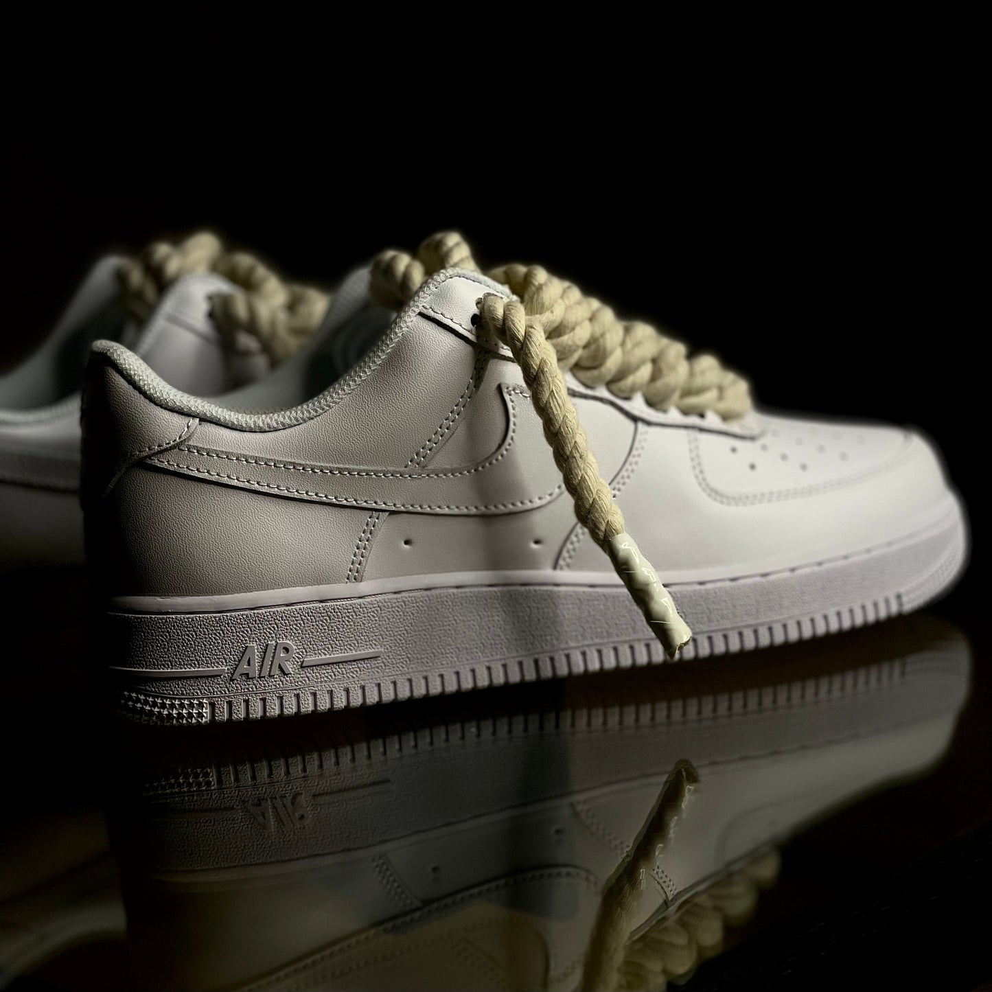 Nike Air Force 1 Low Triple White Rope Lace sneaker side profile on clean background
