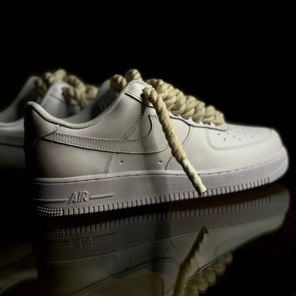 Nike Air Force 1 Low Triple White Rope Lace sneaker side profile on clean background