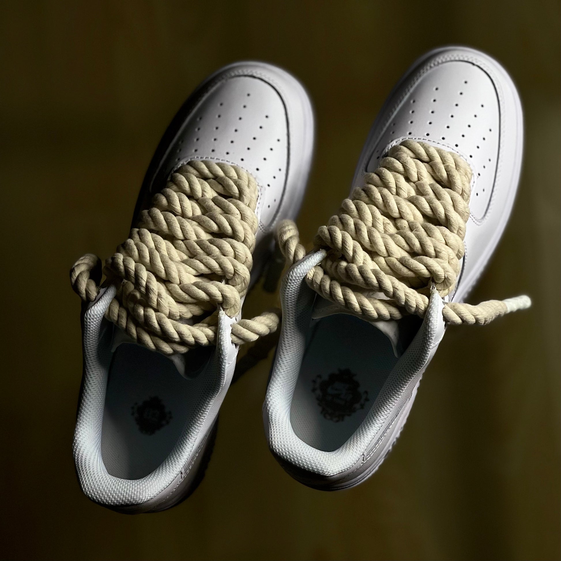 Top-down view of Nike Air Force 1 Low Triple White Rope Lace highlighting texture and craftsmanship