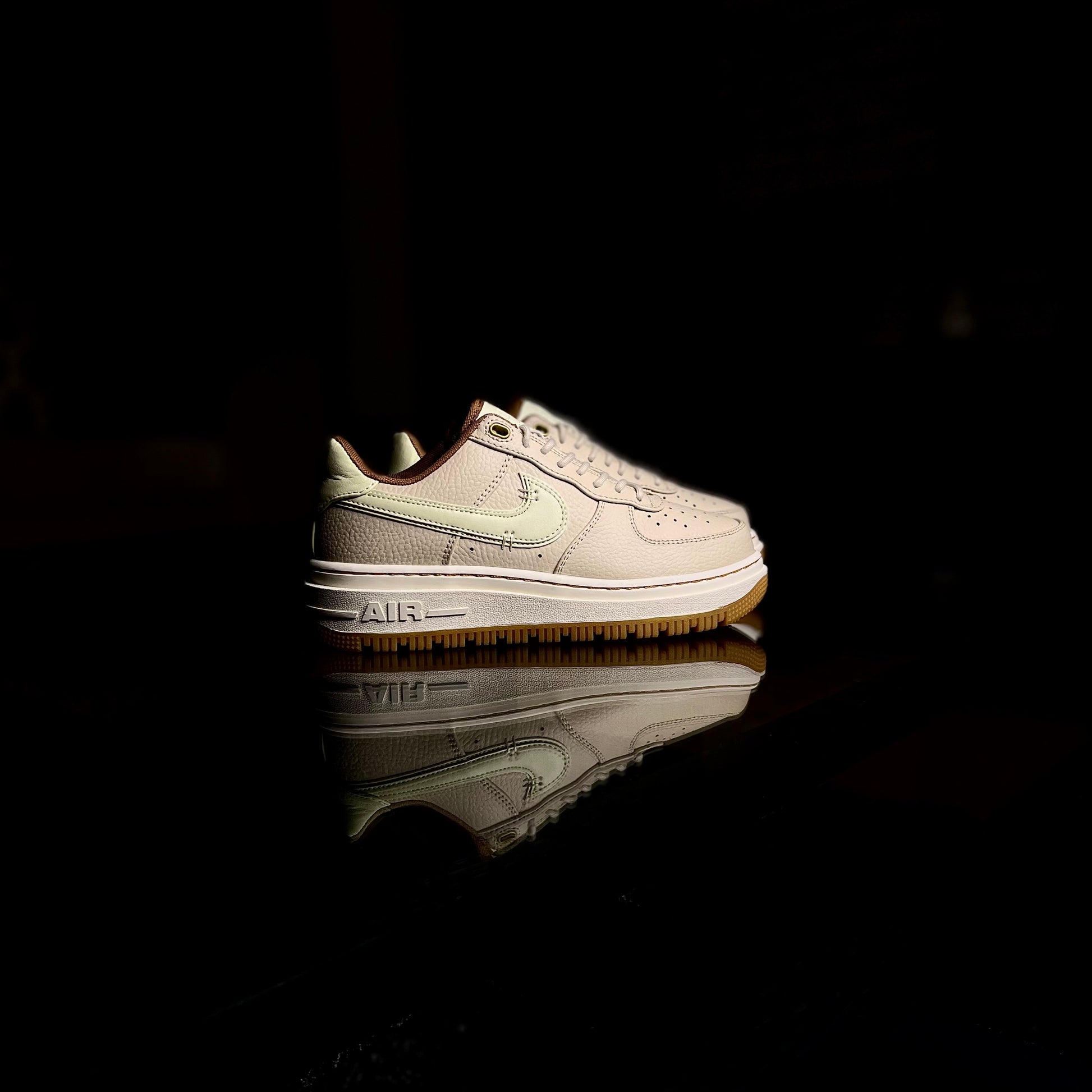 Nike Air Force 1 Luxe Pecan side view — brown leather sneaker with gum sole and stitched detailing