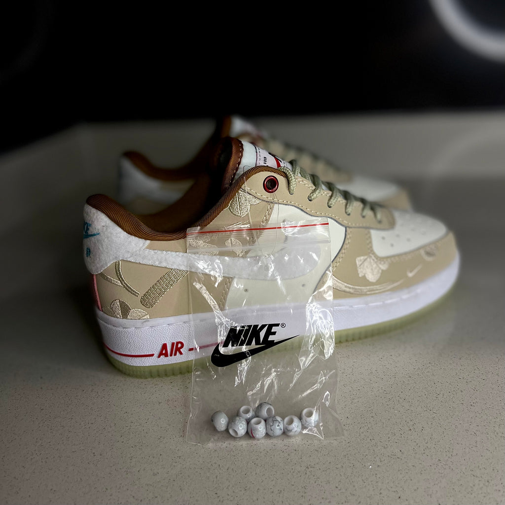 Nike Air Force 1 “Year of the Rabbit” side view — white and pastel sneaker with rabbit embroidery and premium detailing