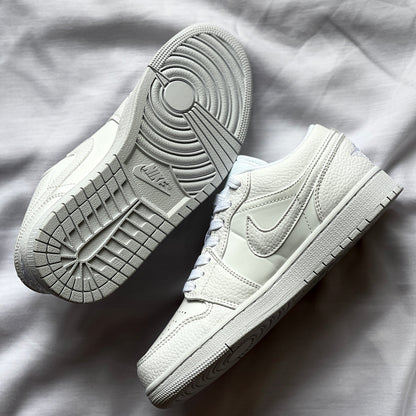 Outsole of Air Jordan 1 Low Triple White featuring durable rubber with signature traction pattern.