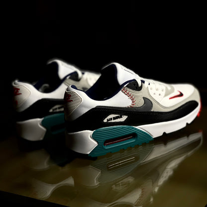 Angled view of Air Max 90 SE Running Club Deep Royal — retro-inspired blue sneaker with tan and red accent