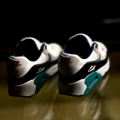 Back view of Air Max 90 SE Running Club Deep Royal — heel tab with Nike Air logo and layered suede panels