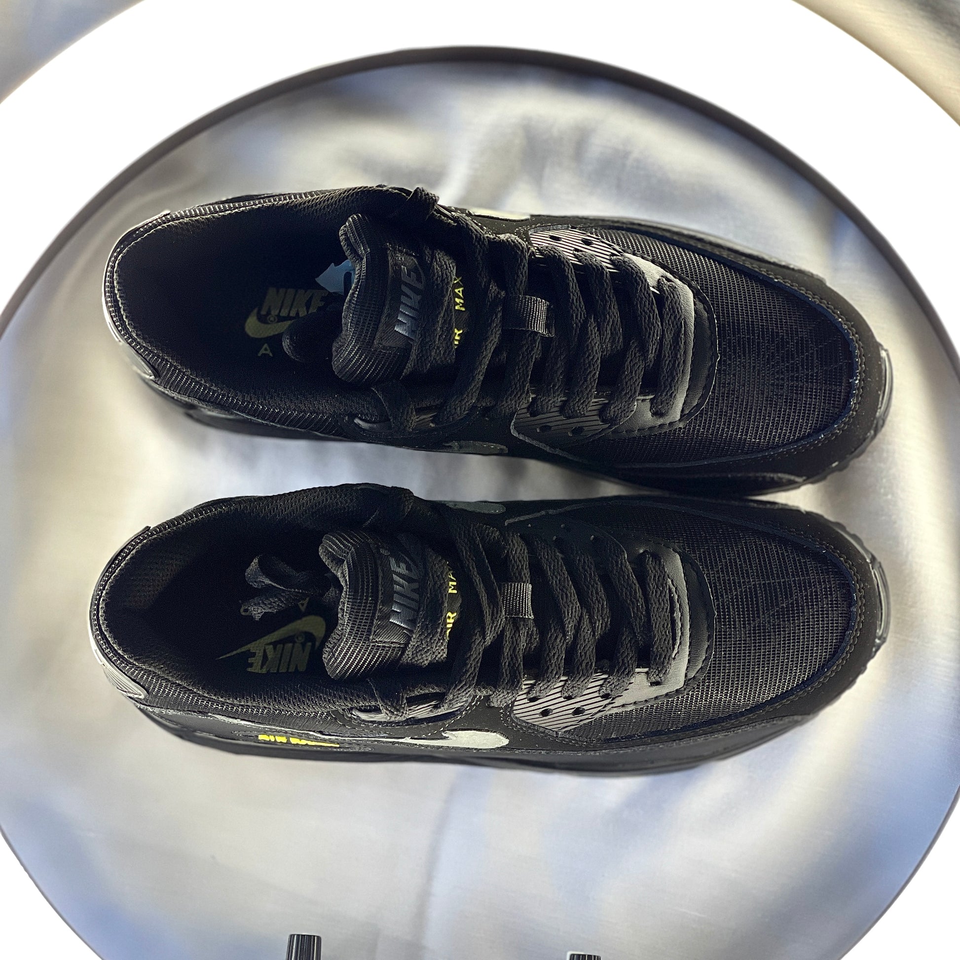 Top-down shot of Halloween Air Max 90 featuring pumpkin-orange accents