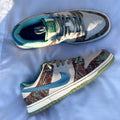 Close-up of green suede overlays on CSC Dunk Low SB