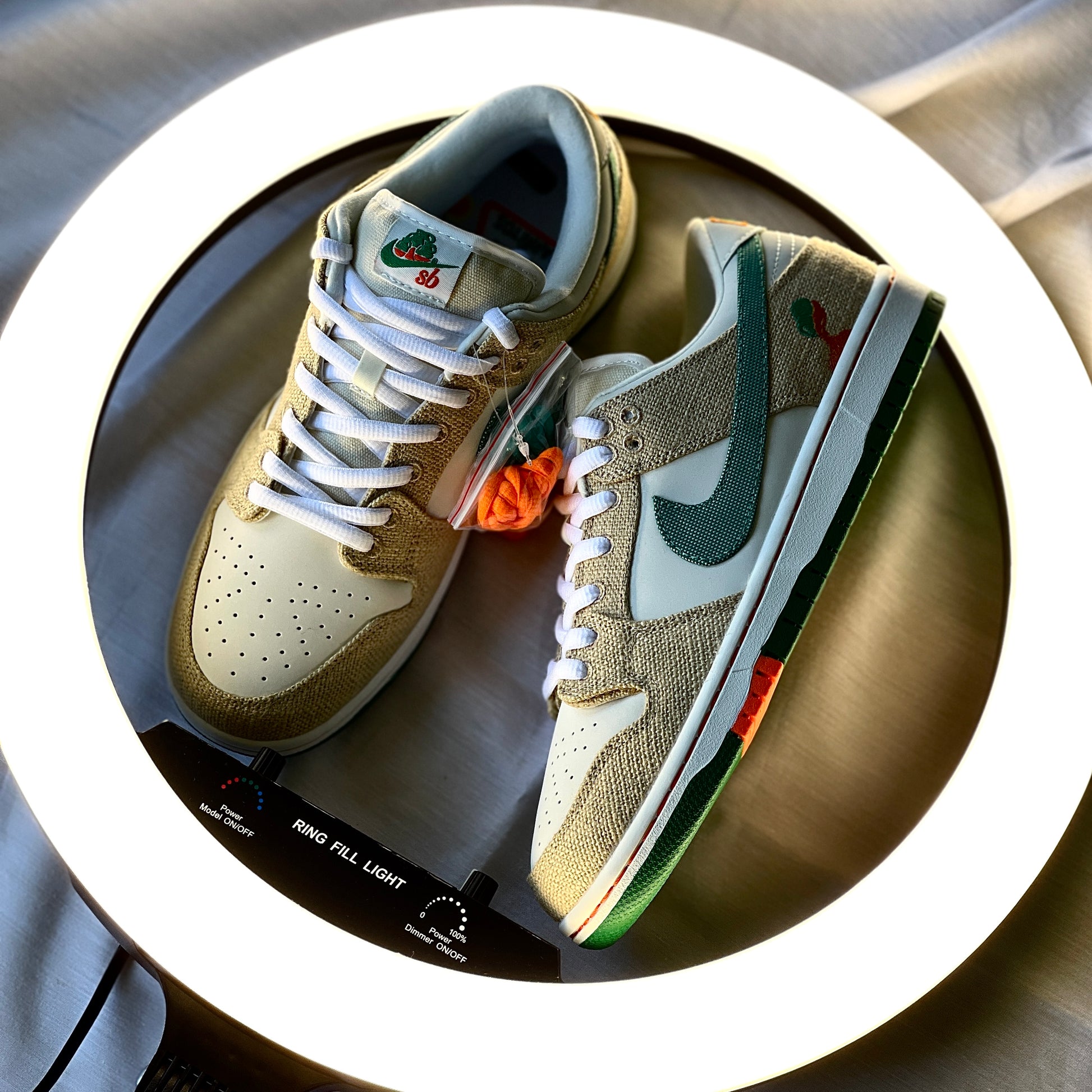 Nike Dunk Low SB Jarritos lateral side profile highlighting hemp texture, swoosh detailing, and Jarritos orange tear-away panels.