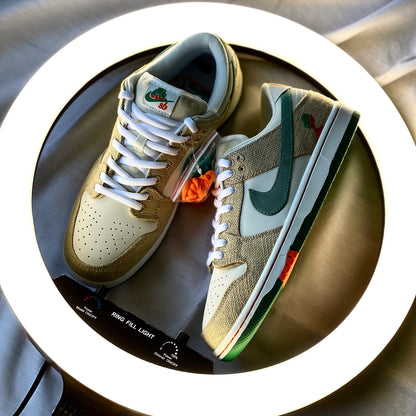 Nike Dunk Low SB Jarritos lateral side profile highlighting hemp texture, swoosh detailing, and Jarritos orange tear-away panels.