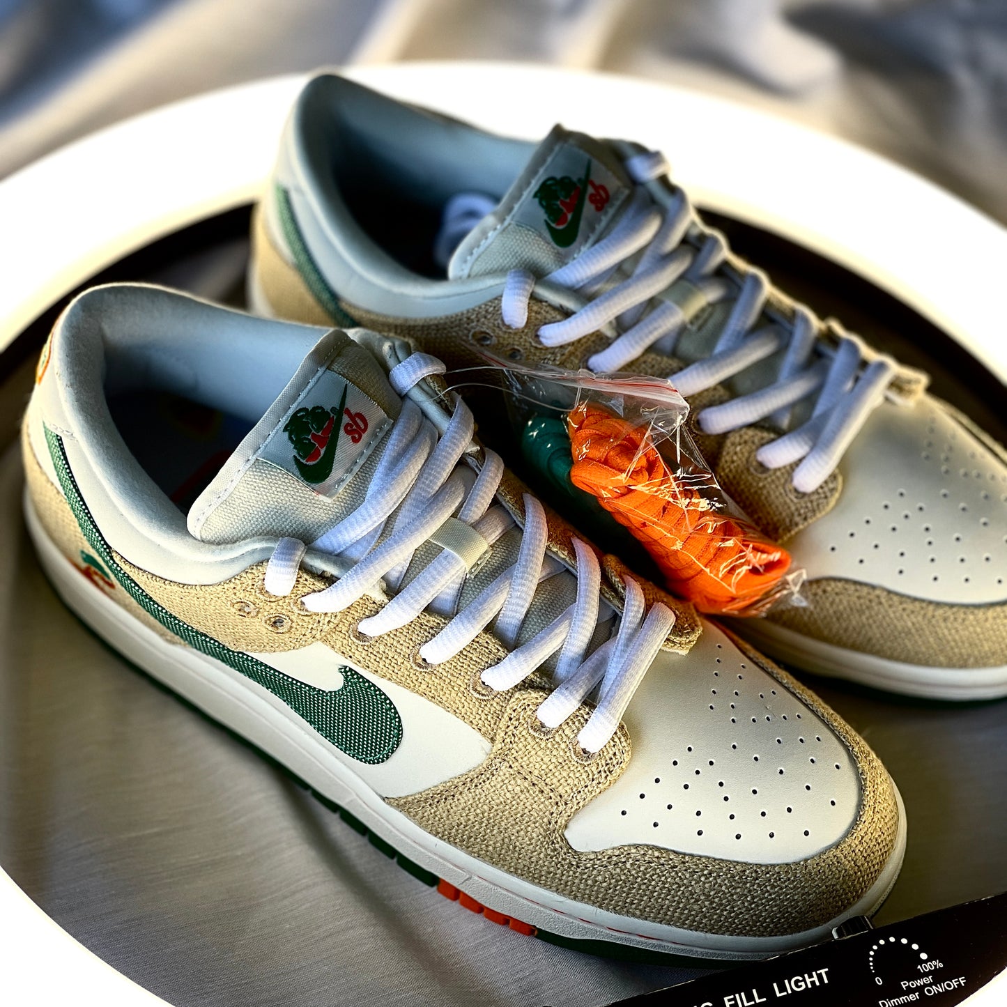 Nike Dunk Low SB Jarritos medial view with white leather, textured hemp overlays, and green swoosh.