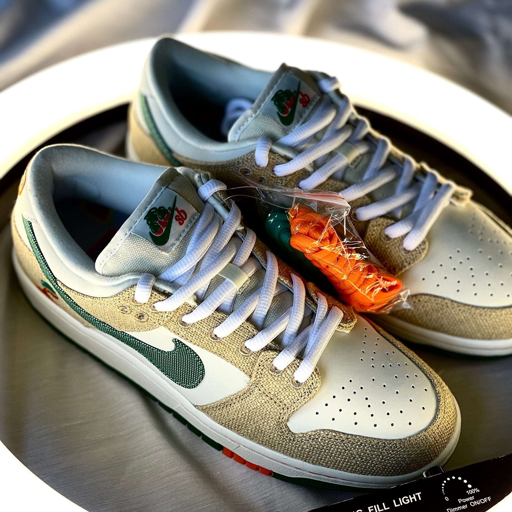 Nike Dunk Low SB Jarritos medial view with white leather, textured hemp overlays, and green swoosh.