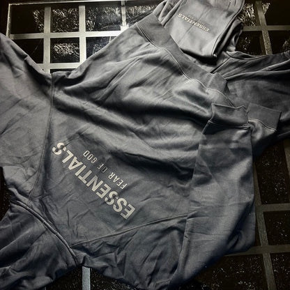 Rear view of Essentials Fear of God Core Collection Black hoodie and pants showing fit and silhouette