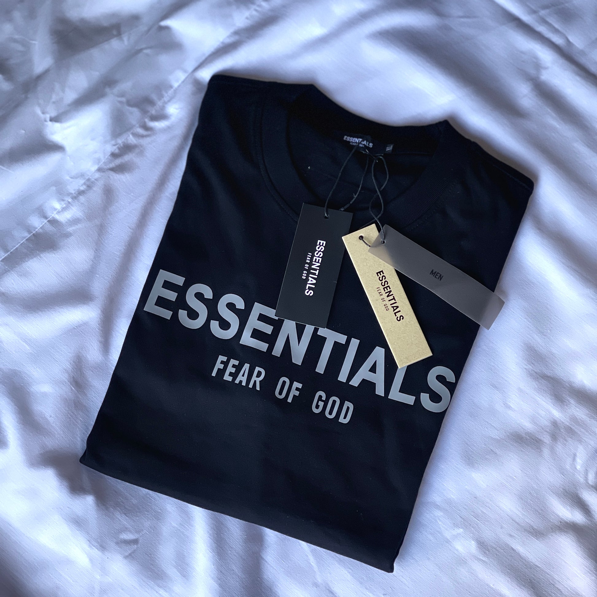 Close-up of Essentials logo detail on T-Shirt