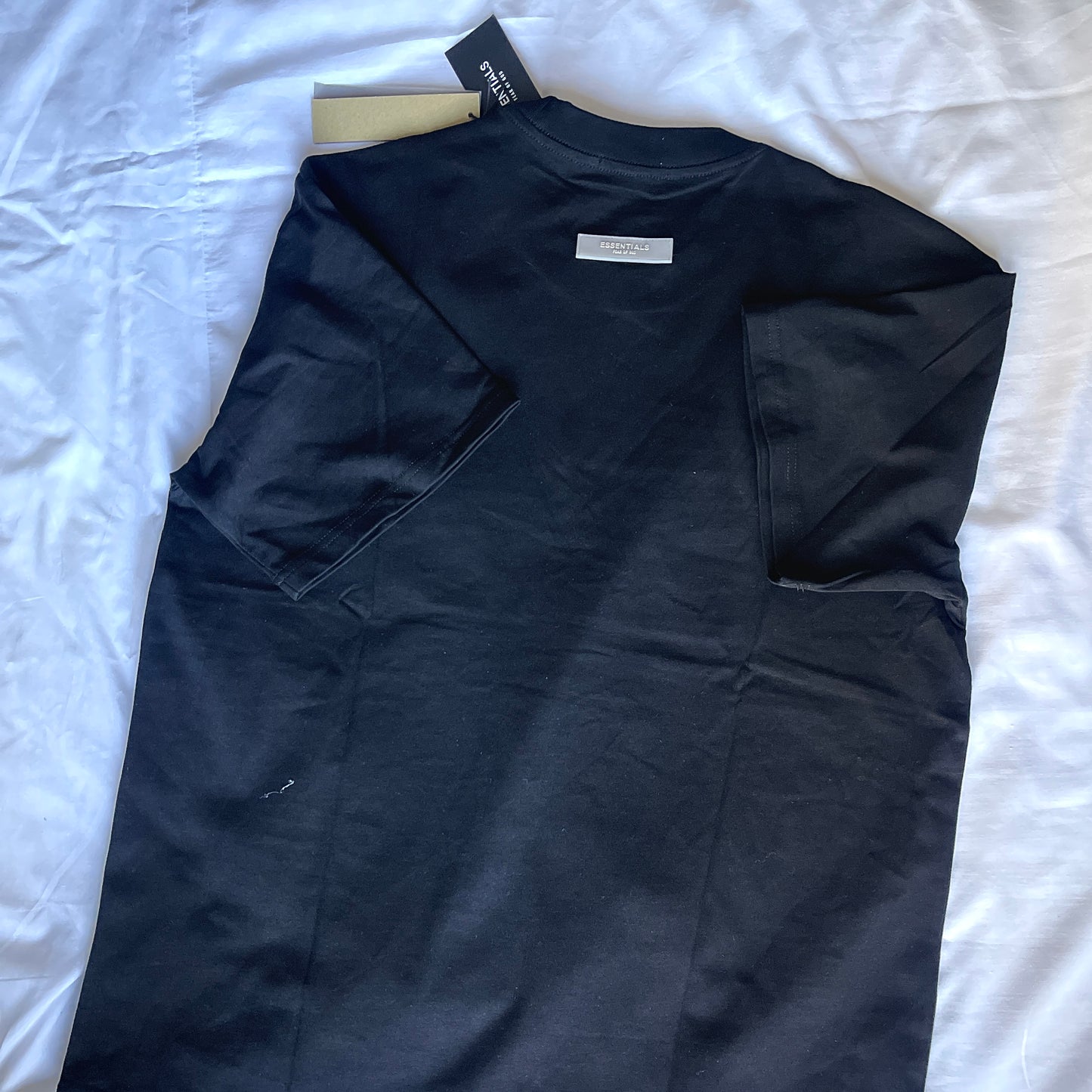 Rear view of Fear of God Essentials T-Shirt branding