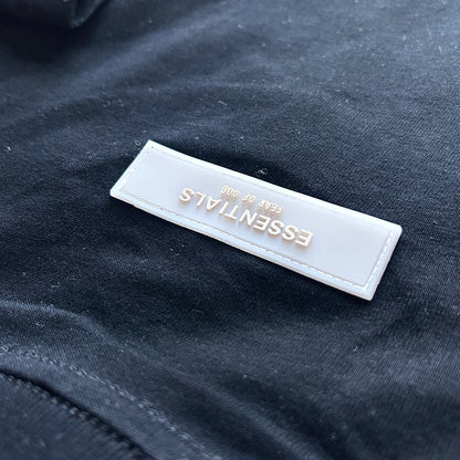 Close-up of Essentials logo detail on T-Shirt