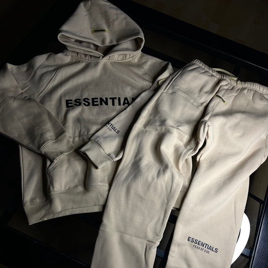 Close-up of Essentials 2-Piece Tracksuit Dusty Beige — premium cotton-blend fabric with ribbed cuffs and subtle branding