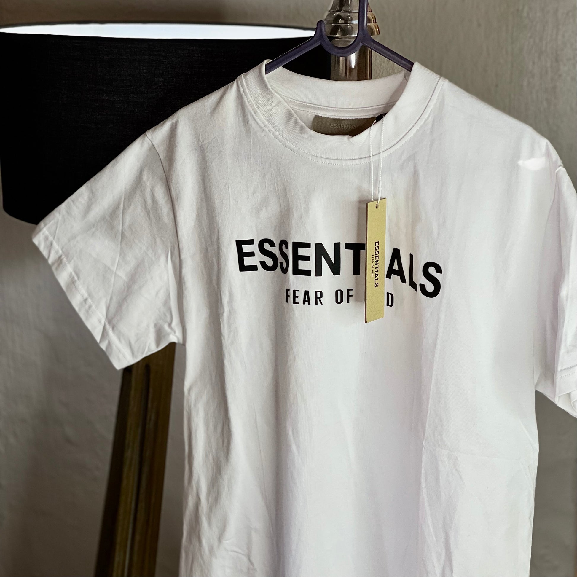 Fear of God Essentials Photo Series Tee White front view — classic white cotton t-shirt with graphic photo print on chest