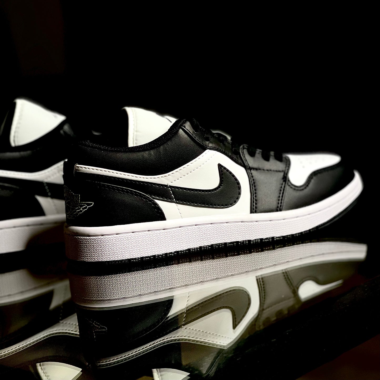 Air Jordan 1 Low Panda sneaker side profile on clean white background