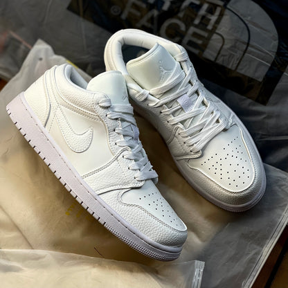 Close-up of Air Jordan 1 Low Triple White smooth leather upper and stitching detail