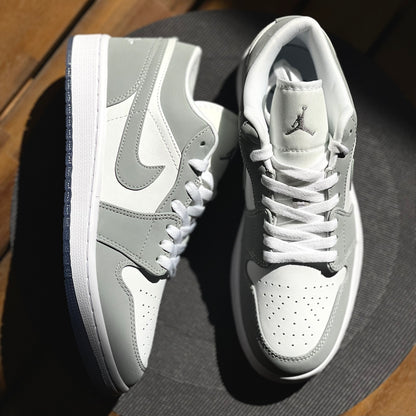 Top-down view of Air Jordan 1 Low Wolf Grey highlighting perforated toe box and lacing detail