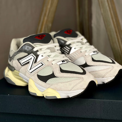 Close-up of New Balance 9060 Raincloud with Casterlock and White — mesh and leather textures with detailed stitching and branding