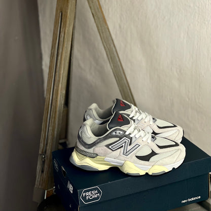 New Balance 9060 Raincloud with Casterlock and White side view — grey and white retro-inspired sneaker with signature midsole design