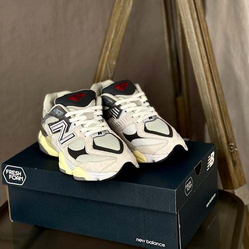 Angled view of New Balance 9060 Raincloud with Casterlock and White — grey and white sneaker highlighting modern-retro design and comfort features
