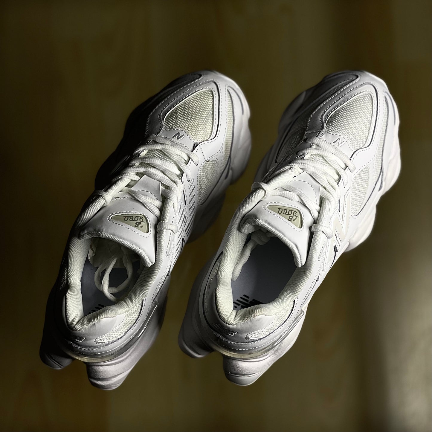 Top view of New Balance 9060 Triple White — white leather and mesh upper with tonal laces and cushioned tongue