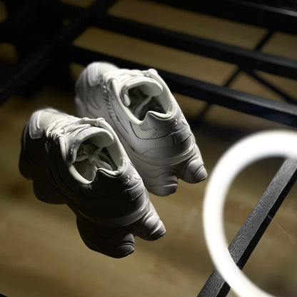 Back view of New Balance 9060 Triple White — heel tab with subtle NB branding and clean all-white paneling