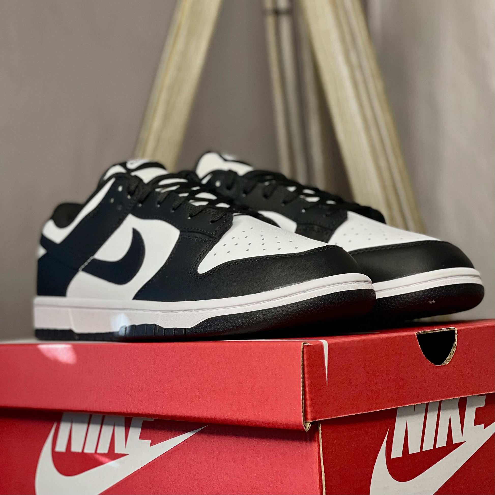 Close-up of Nike Dunk Low Panda leather texture and stitching details — premium low-top sneaker design