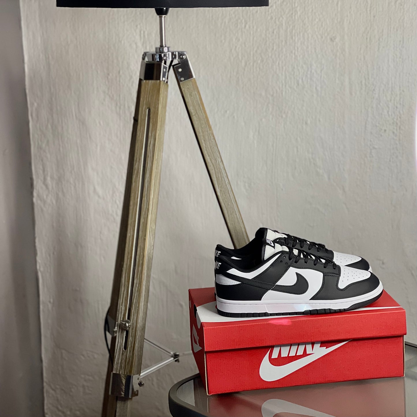 Nike Dunk Low Panda side view — black and white low-top sneaker with leather upper and classic Dunk silhouette