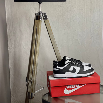 Nike Dunk Low Panda side view — black and white low-top sneaker with leather upper and classic Dunk silhouette