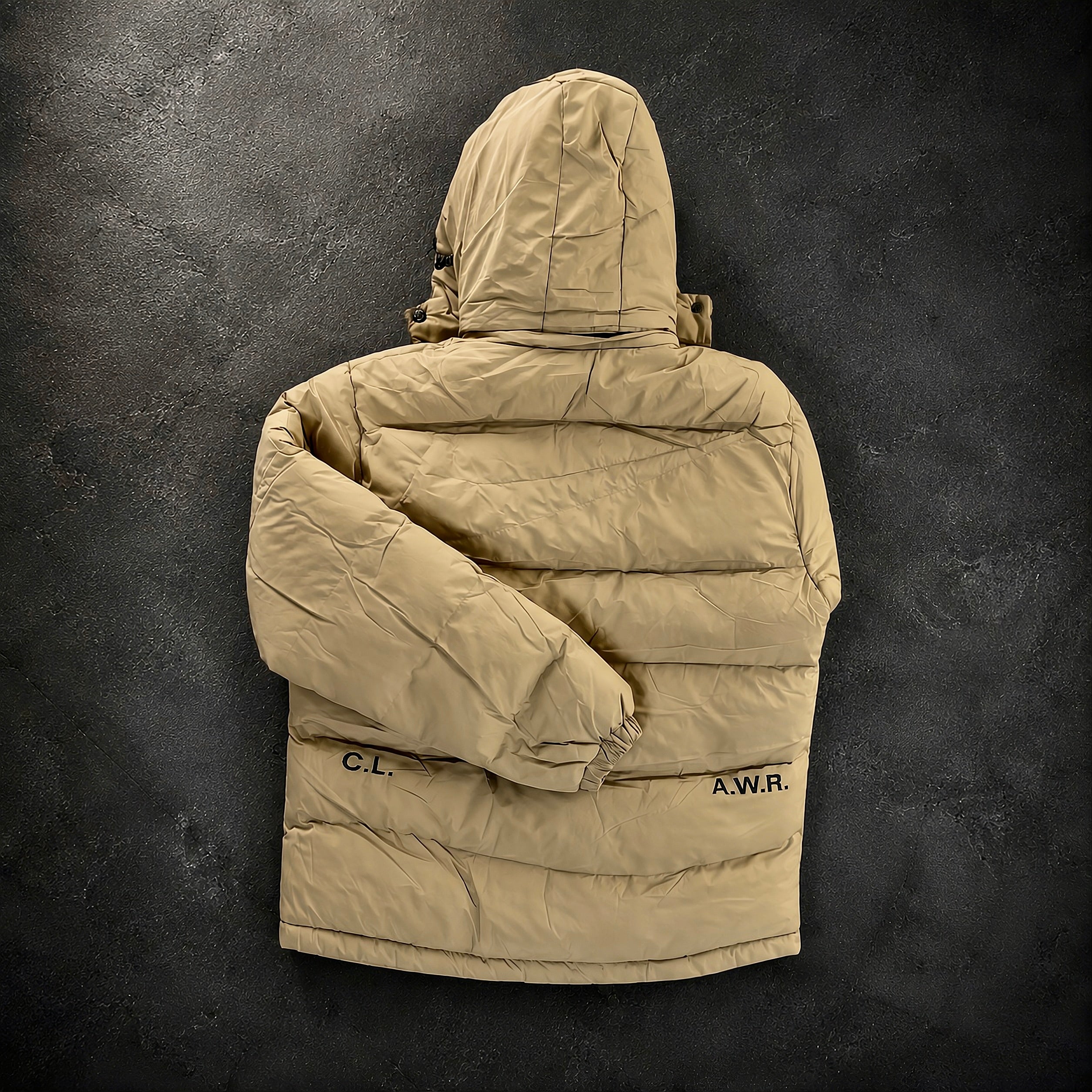 Nike x Drake NOCTA Storm-FIT Skulpeak Puffer Jacket Bone rear angled view highlighting quilted insulation, technical outer shell and premium NOCTA craftsmanship.