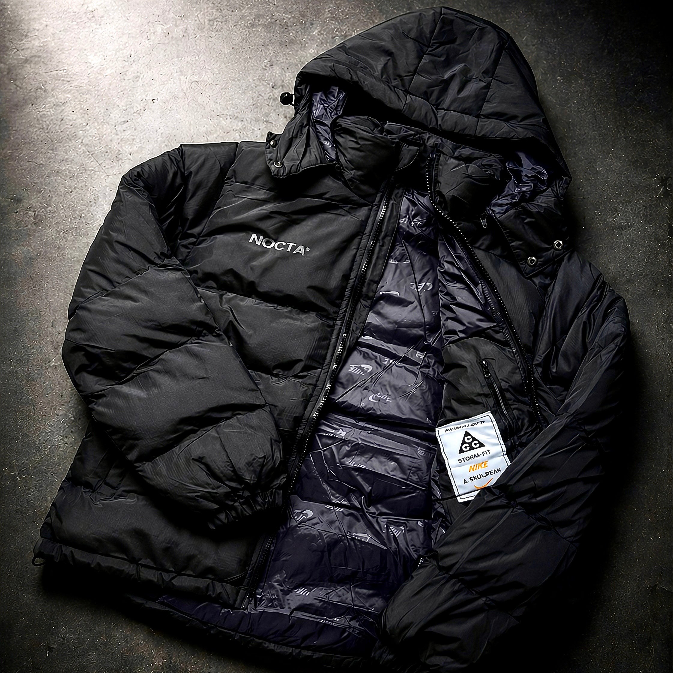 Open view showing inner lining on NOCTA Skulpeak jacket